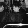 Women on train reflected in windows