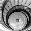 Pendulum at bottom of spiral stairs.